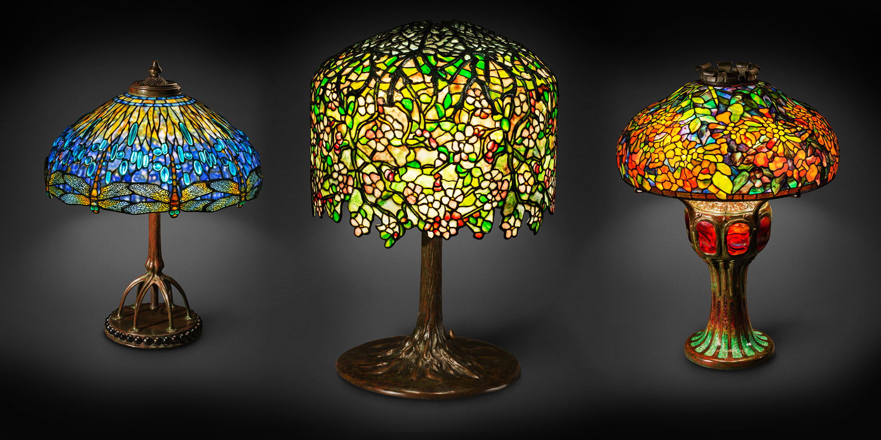 three colorful Tiffany lamps