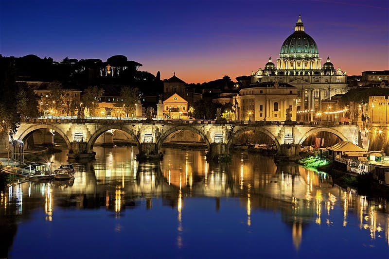 Vatican City and Tiber bridge at night