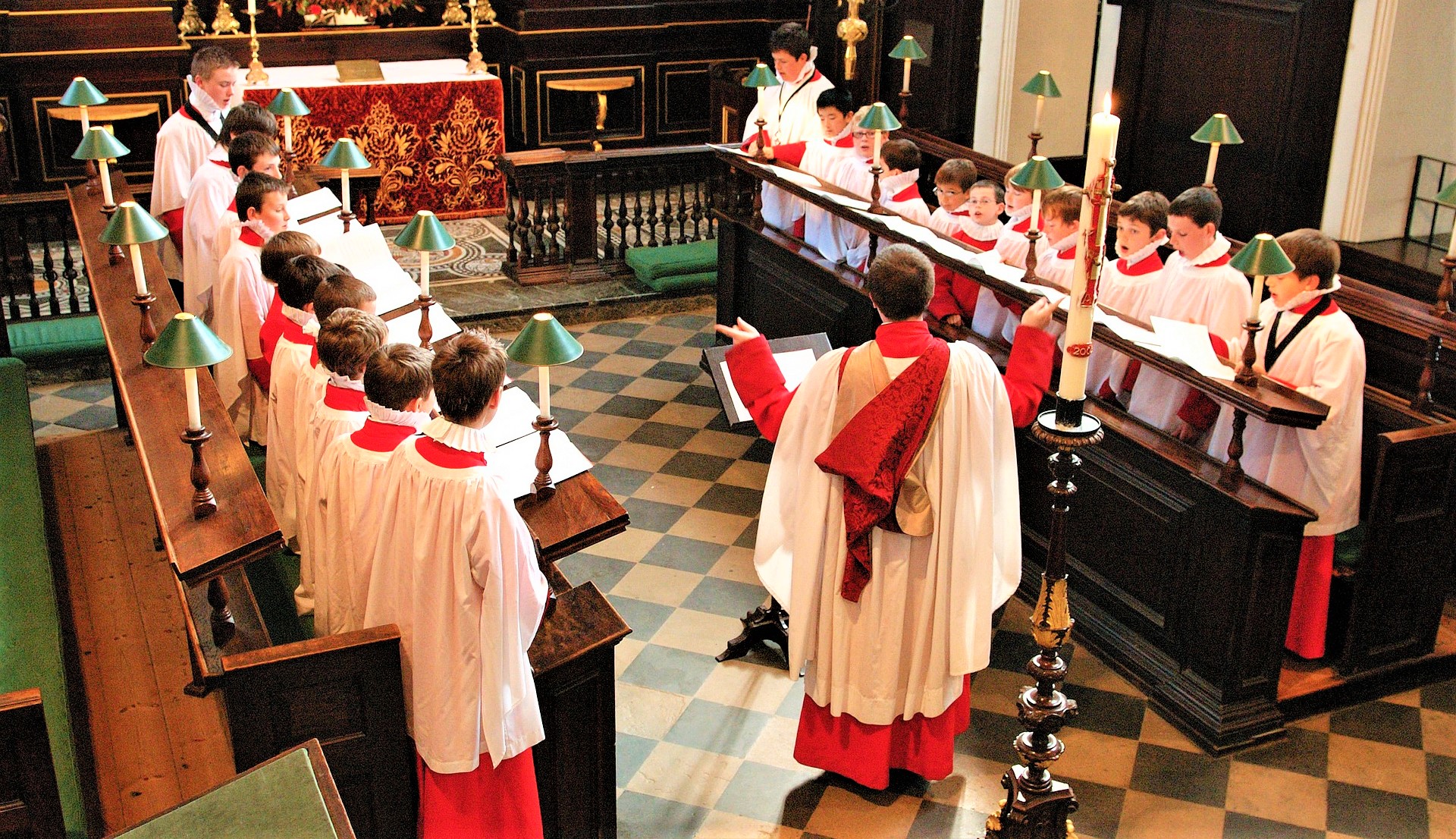 English boys choir rehearsing in a church