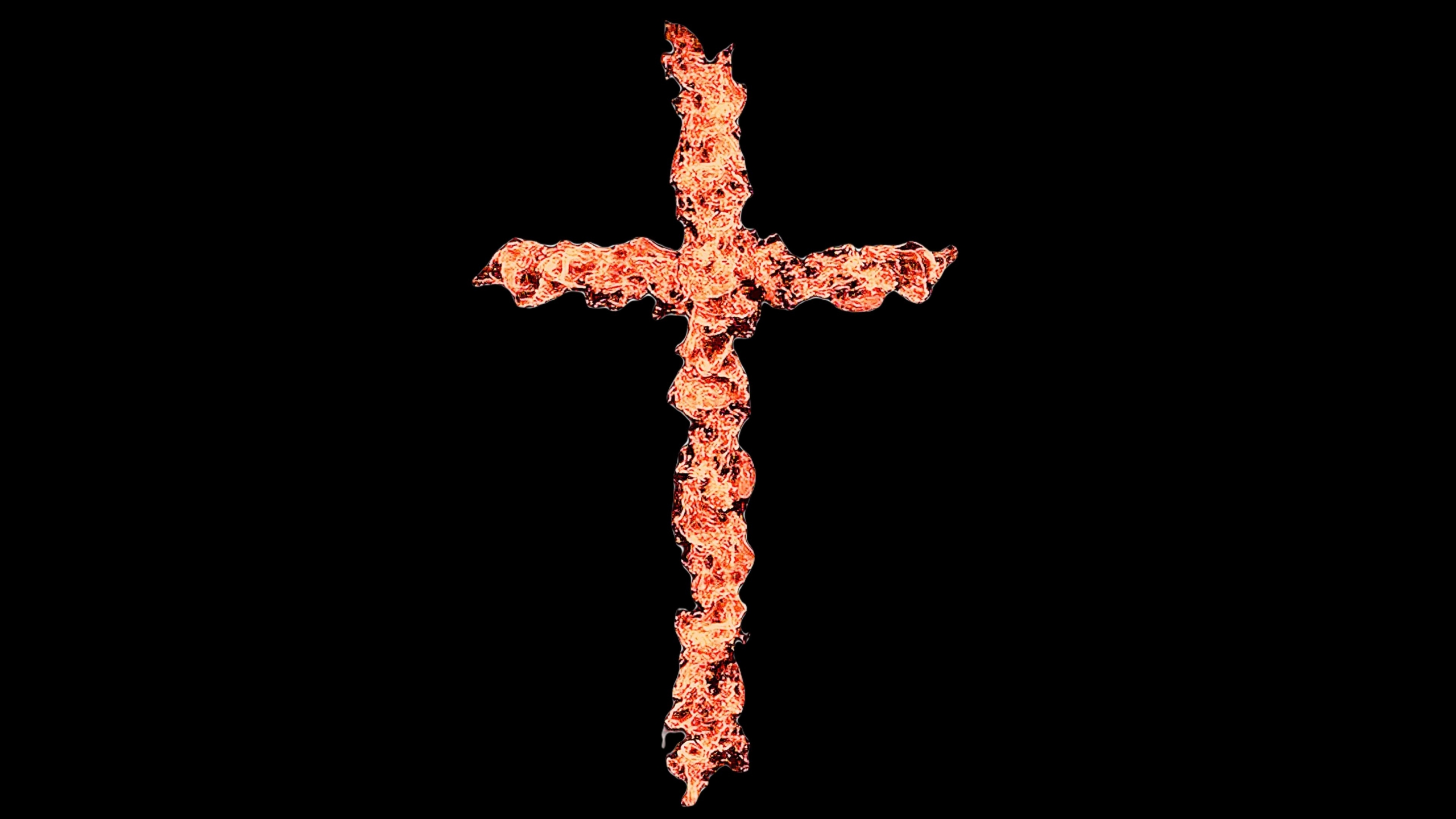 cross that looks like it's made of fire with black background