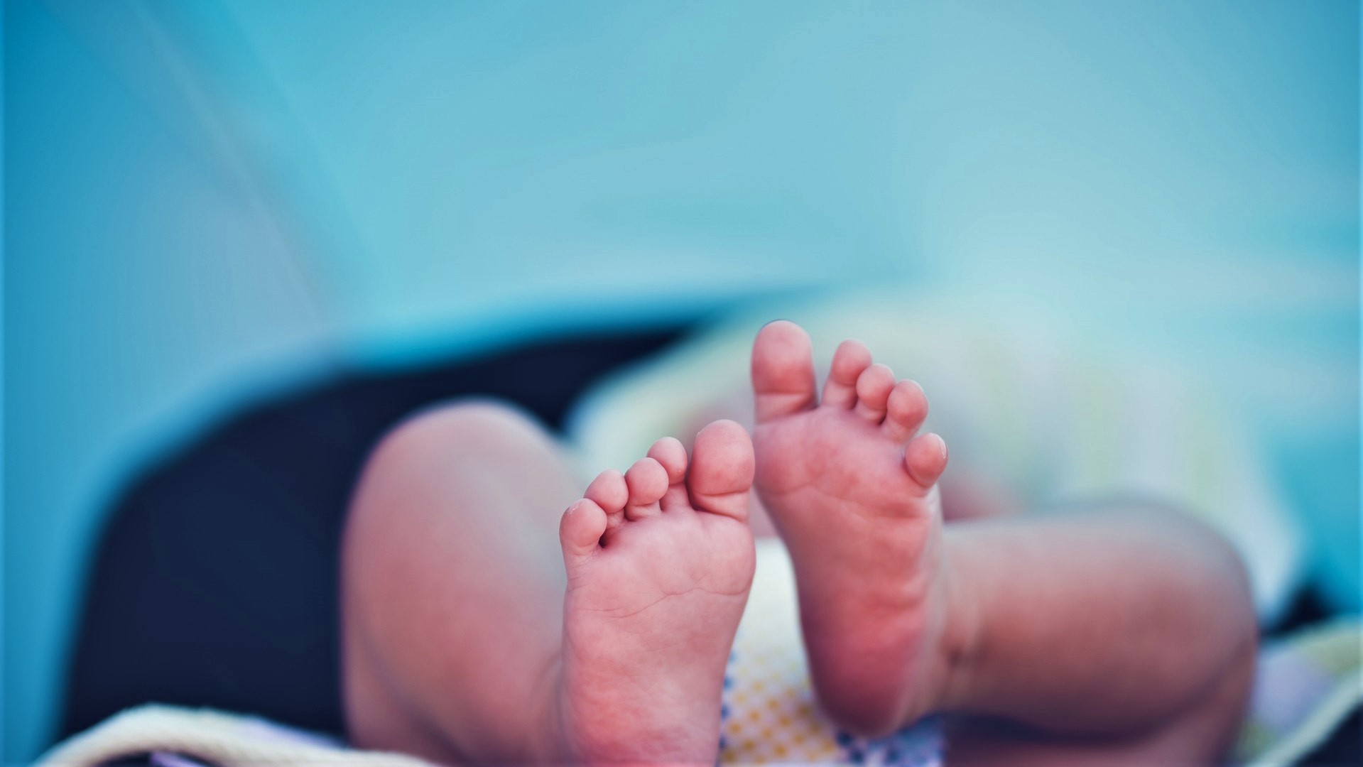 Feet and legs of baby sleeping