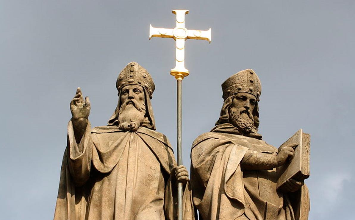 two bishops with cross between them
