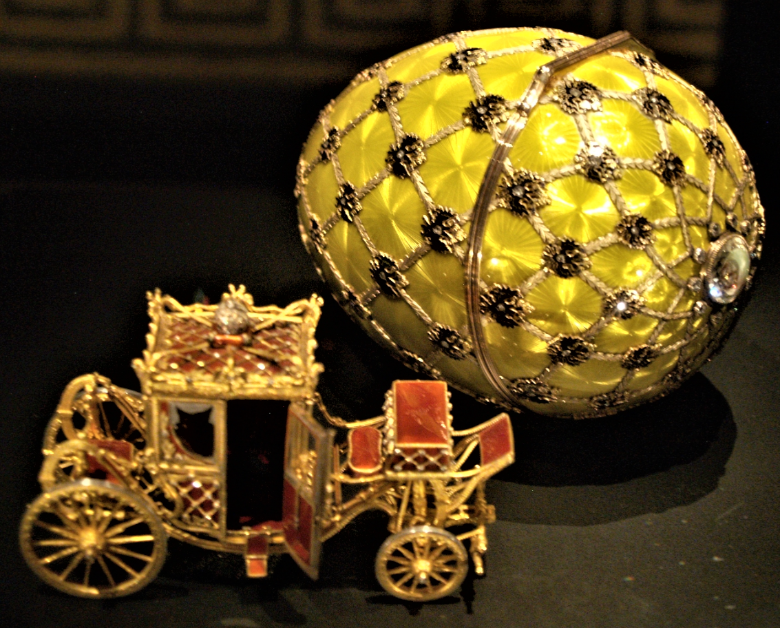 Golden Faberge egg with miniature carriage