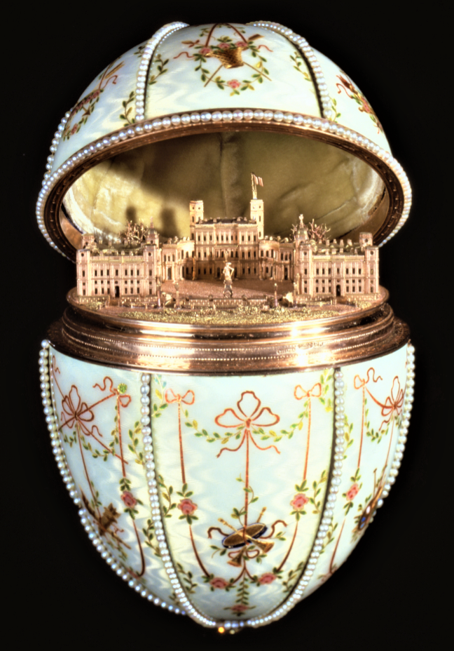 ornate Faberge egg with pearls and miniature palace carving inside