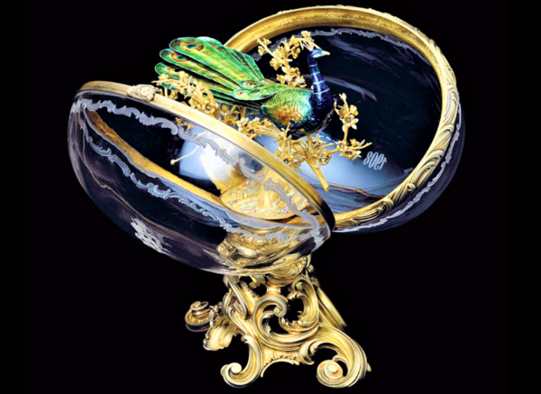 clear crystal Faberge egg with miniature peacock inside