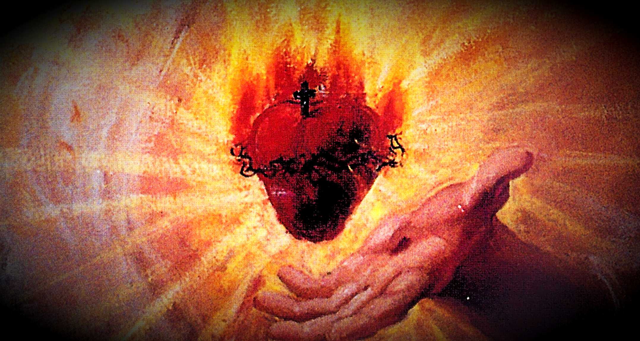 glowing red heart of Christ with hand underneath as if offering