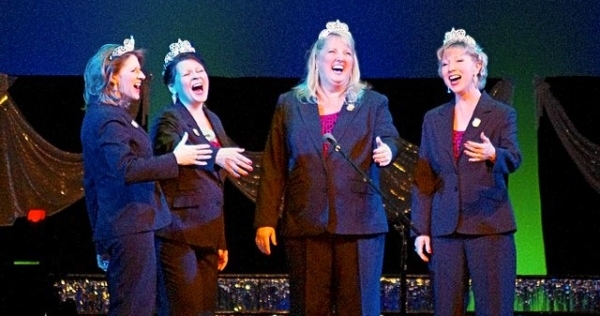 Four singing ladies in blue