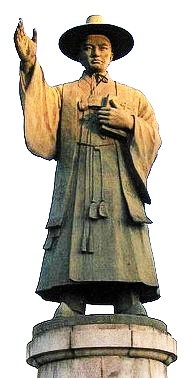 full size statue of St Andrew Kim raising his hand in blessing