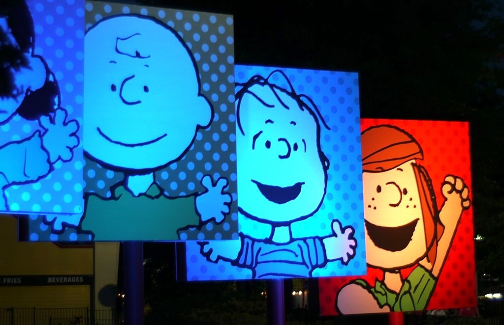 panels of Peanuts cartoon characters Charlie Brown, Linus, Lucy