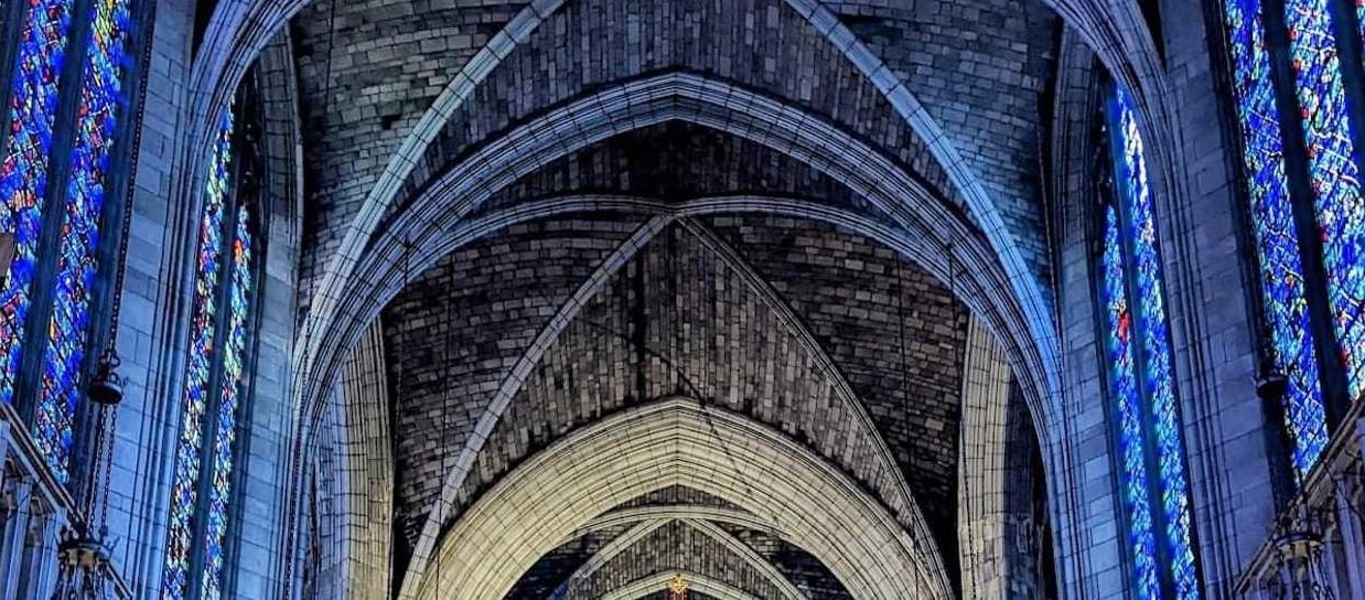 pointed arches and stained glass windows of a Gothic church